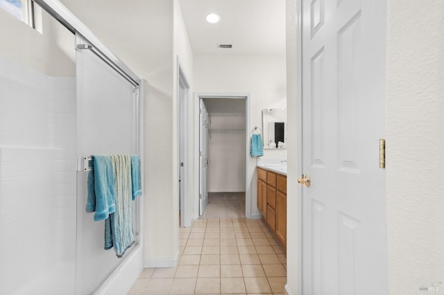 full bath featuring visible vents, a shower, tile patterned flooring, vanity, and recessed lighting