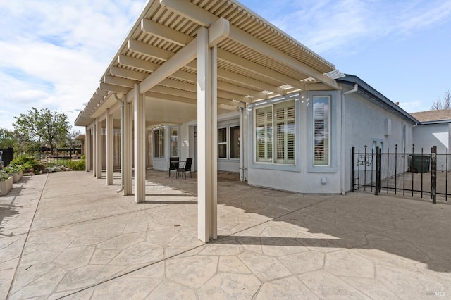 view of patio featuring fence