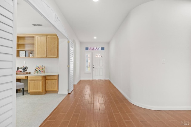 foyer entrance featuring recessed lighting, visible vents, baseboards, light wood-type flooring, and built in study area