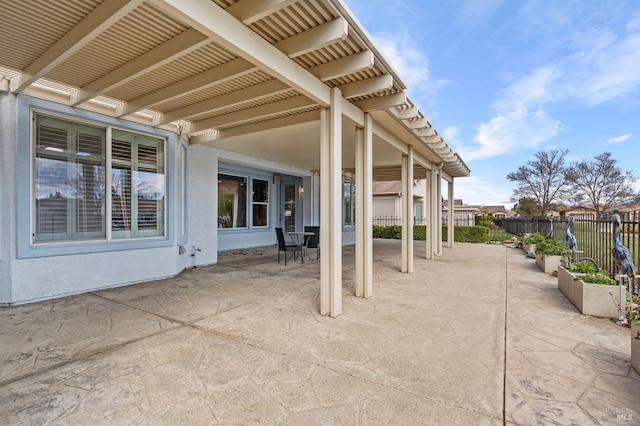 view of patio featuring fence