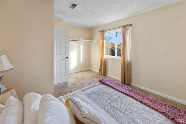 bedroom with carpet flooring, visible vents, and baseboards