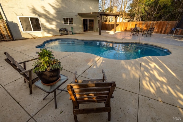 view of pool featuring a patio area, a fenced backyard, and a fenced in pool