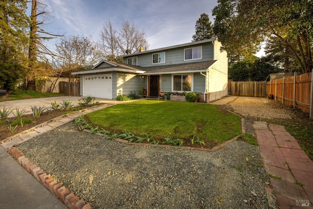 traditional-style house with an attached garage, fence, a front lawn, and concrete driveway