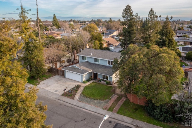 birds eye view of property with a residential view