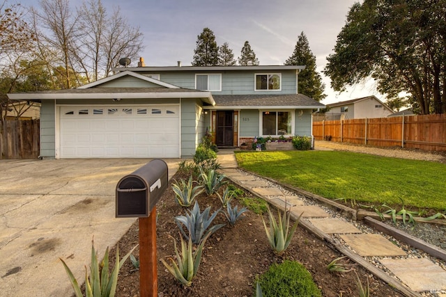 traditional-style home with driveway, a shingled roof, an attached garage, fence, and a front yard