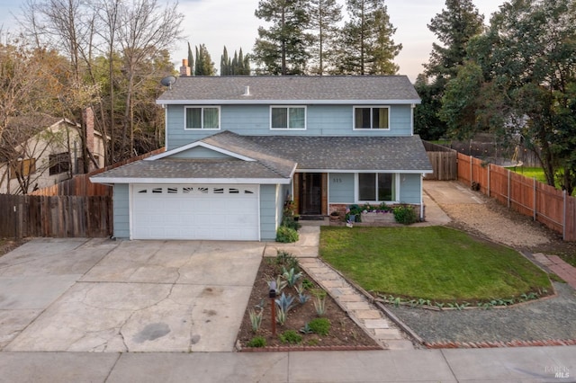 traditional-style house with a garage, a shingled roof, fence, and concrete driveway