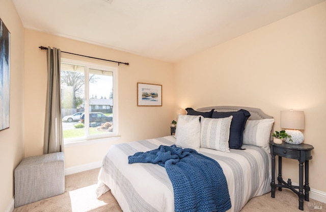 carpeted bedroom with baseboards