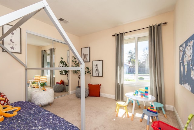 bedroom featuring baseboards, visible vents, and carpet flooring