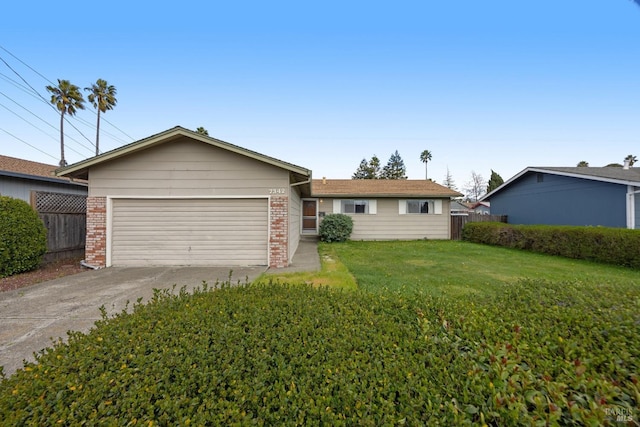 ranch-style home featuring concrete driveway, brick siding, fence, and a front lawn