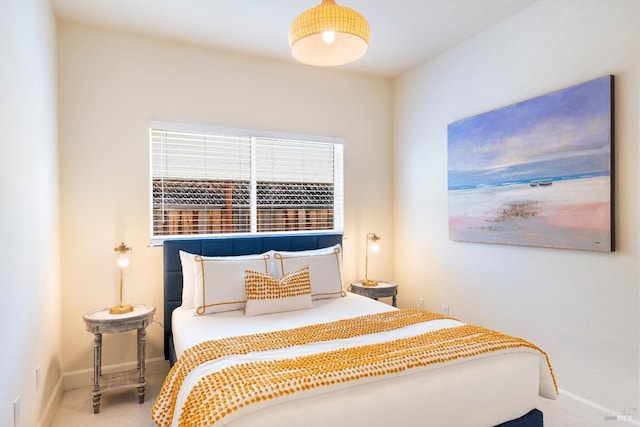 bedroom featuring carpet floors and baseboards