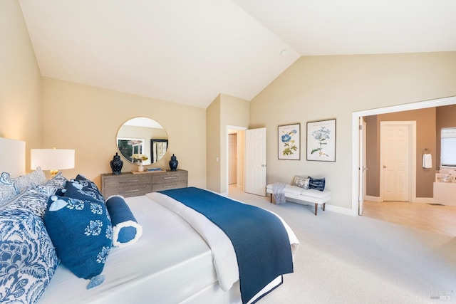 bedroom featuring vaulted ceiling, carpet floors, and baseboards