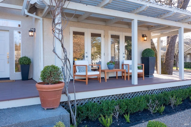 view of patio featuring french doors and a pergola