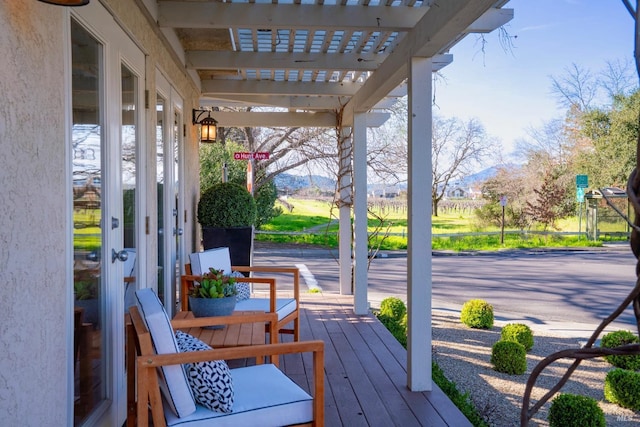 wooden deck with a pergola