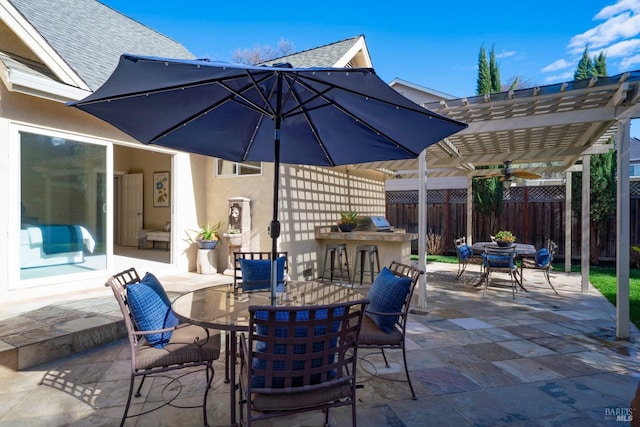 view of patio with outdoor dining area, area for grilling, fence, and a pergola