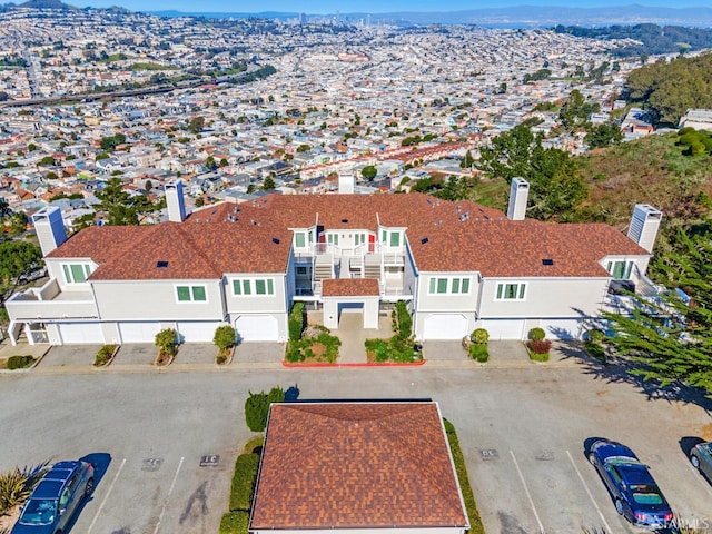 birds eye view of property with a residential view