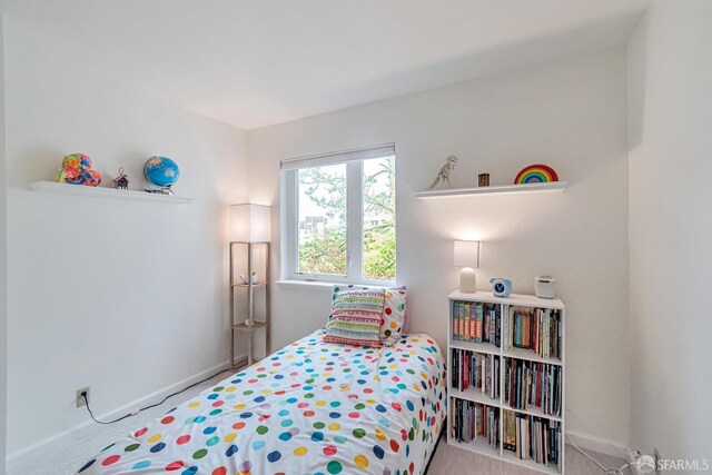 bedroom featuring baseboards