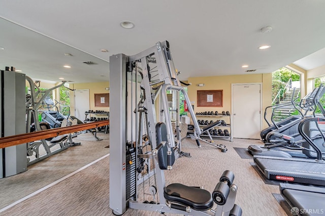 workout area featuring plenty of natural light, carpet flooring, and recessed lighting