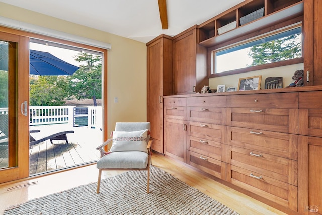 sitting room with visible vents and light wood-style floors