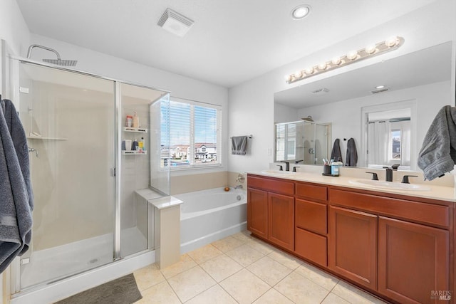 full bathroom featuring a sink, visible vents, tile patterned floors, double vanity, and a stall shower