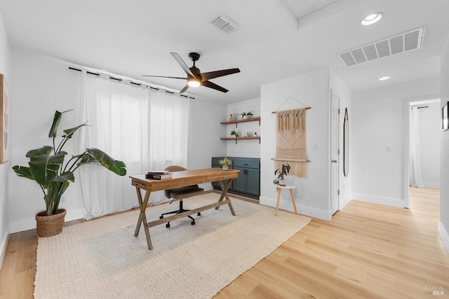 home office with baseboards, light wood-type flooring, visible vents, and recessed lighting