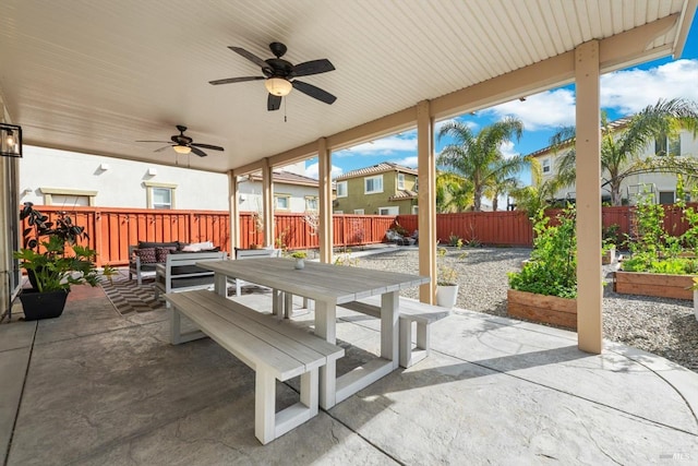 view of patio featuring ceiling fan, a garden, a fenced backyard, and an outdoor living space