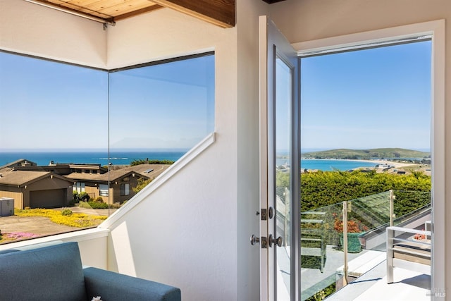 balcony featuring a water view