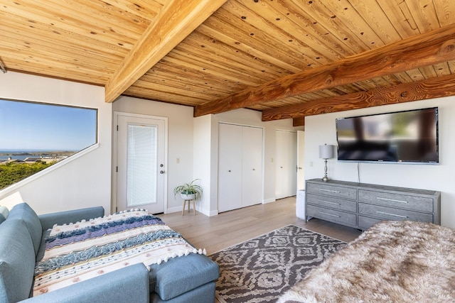 living area with wooden ceiling, wood finished floors, baseboards, and beam ceiling