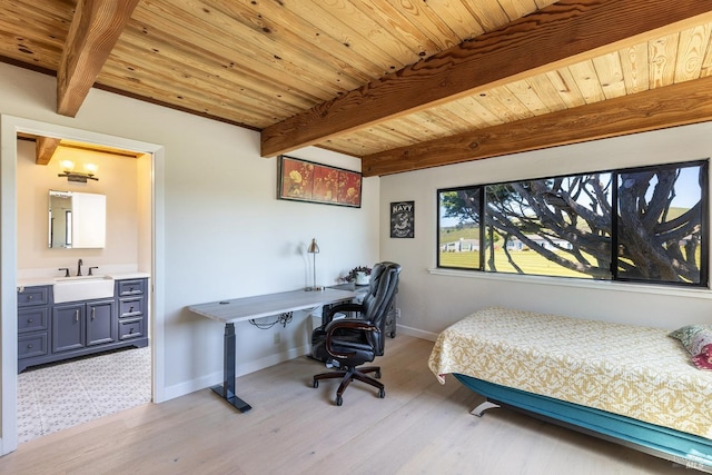 bedroom with beam ceiling, baseboards, wooden ceiling, and a sink