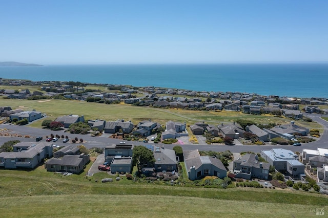 drone / aerial view featuring a residential view and a water view