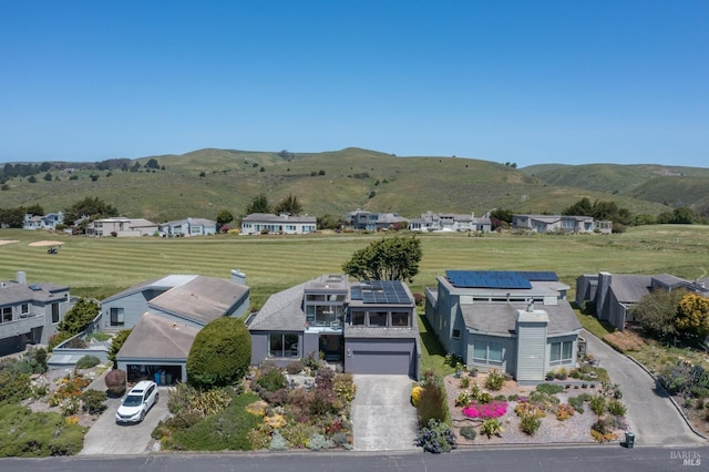 birds eye view of property with a mountain view