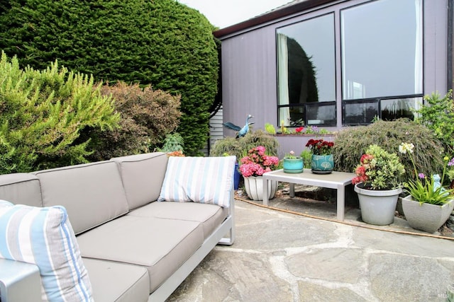 balcony with a patio area and an outdoor hangout area