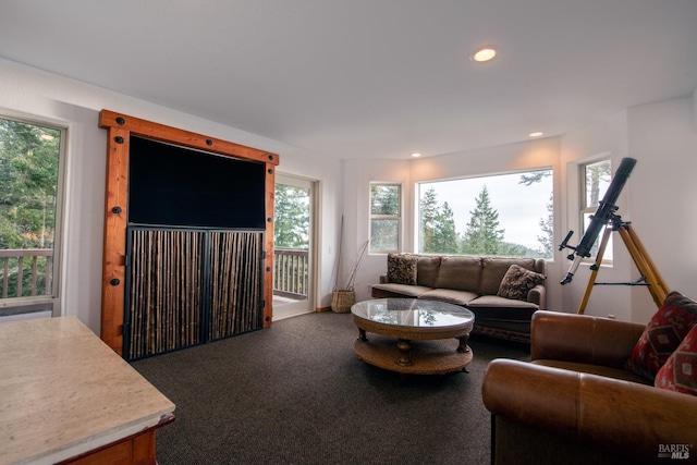 carpeted living room with recessed lighting