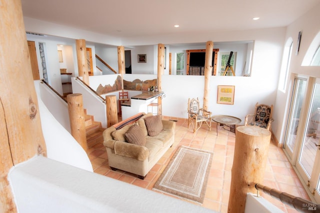 living area featuring stairs and recessed lighting