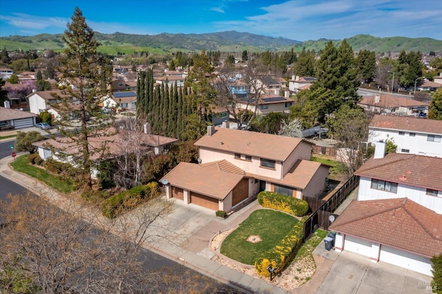 birds eye view of property with a mountain view and a residential view