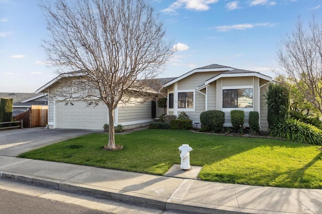 ranch-style house with driveway, a garage, roof with shingles, fence, and a front lawn