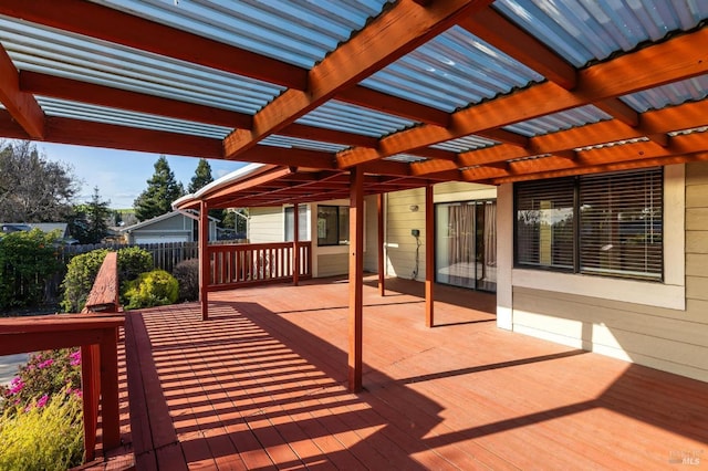 wooden deck with fence and a pergola