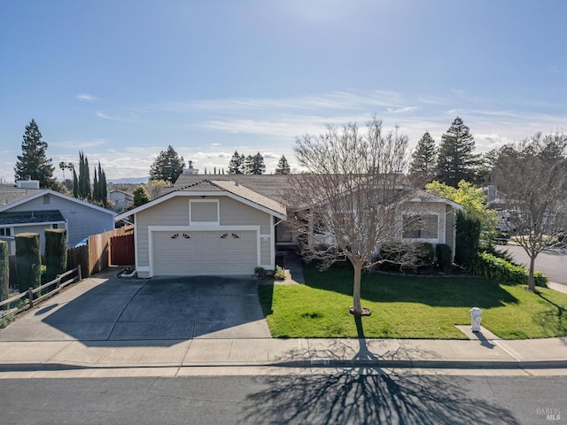 view of front of property with a garage, concrete driveway, a front lawn, and fence