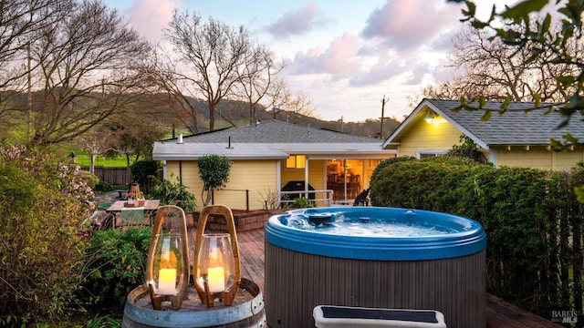 exterior space featuring a hot tub