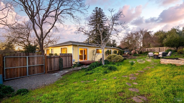 view of yard featuring fence and a gate