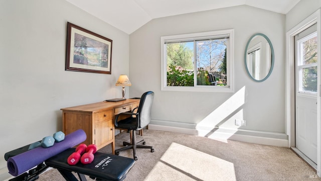 office featuring carpet floors, lofted ceiling, plenty of natural light, and baseboards