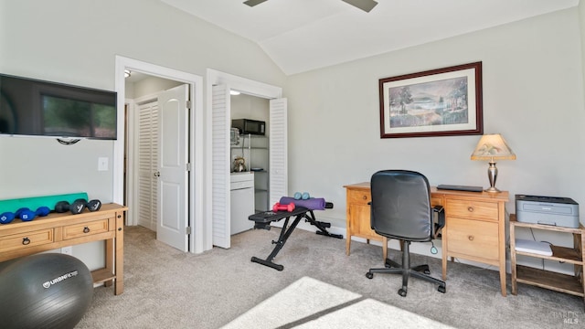 office with a ceiling fan, light carpet, and vaulted ceiling