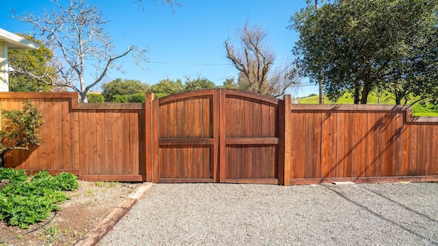 view of gate with fence