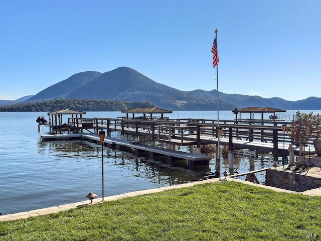 view of dock featuring a water and mountain view