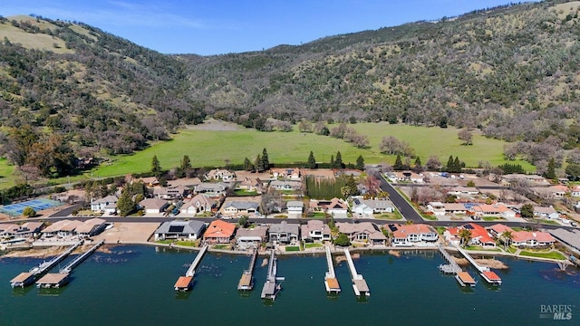 birds eye view of property with a residential view and a water and mountain view