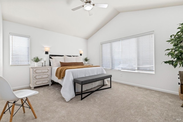 bedroom featuring carpet, baseboards, vaulted ceiling, and a ceiling fan