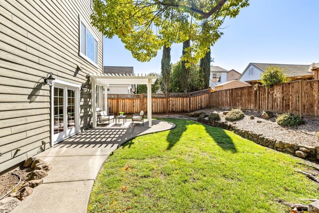 view of yard featuring a patio area, a fenced backyard, and a pergola