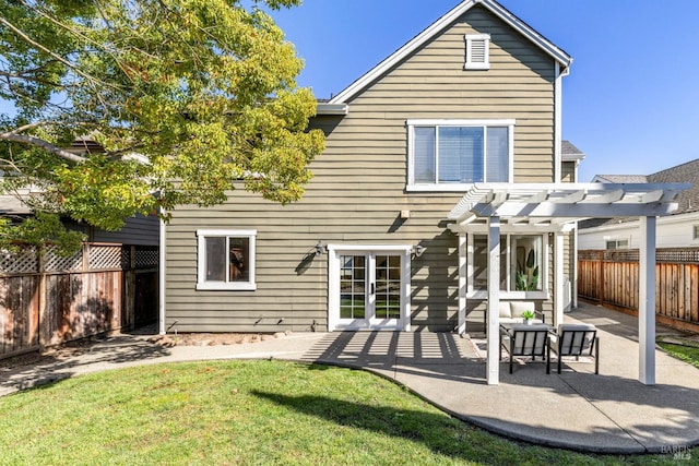 rear view of property with a fenced backyard, a patio, a lawn, and a pergola