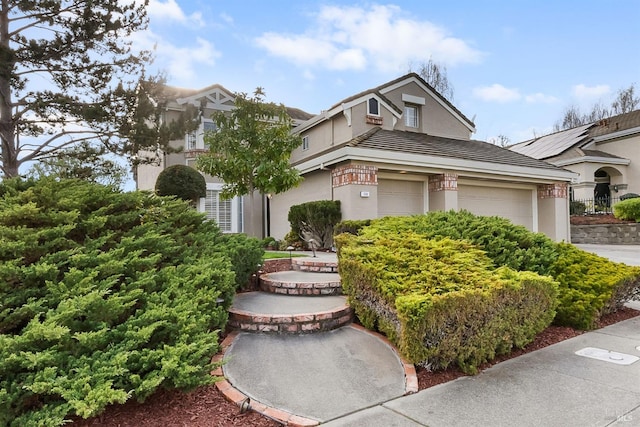 view of front of house featuring a garage and stucco siding