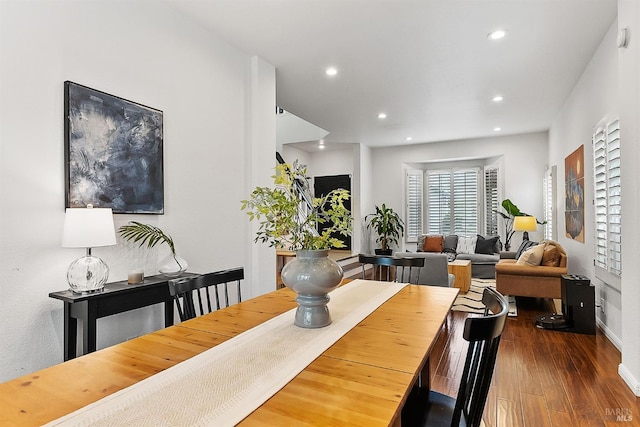 dining space featuring recessed lighting, baseboards, and wood finished floors