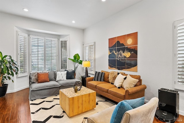 living room featuring recessed lighting, light wood finished floors, and baseboards